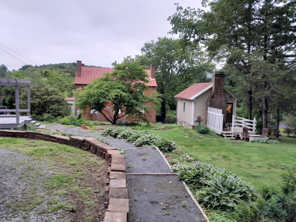 View from the back of the Crossroads Inn, showing the original building plus a little cabin that can be rented.